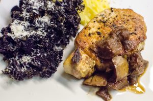 Purple kale and thick-cut pork chop with apple dressing